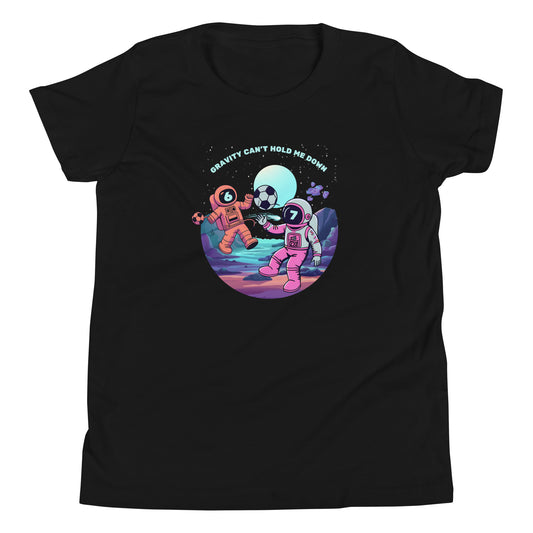 Gravity Can't Hold Me Down shirt for kids featuring two characters in spacesuits playing soccer in space, with a 6 on one helmet and a 7 on the other.