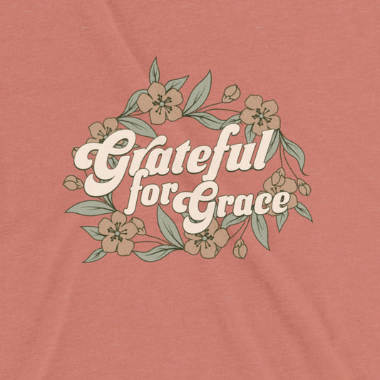 T-shirt with 'Grateful for Grace' text and floral design on a mauve background