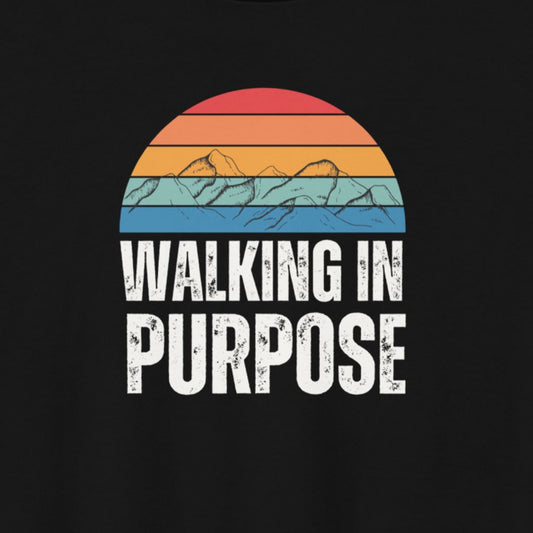 Black t-shirt with 'Walking in Purpose' text and colorful mountain design on a black background