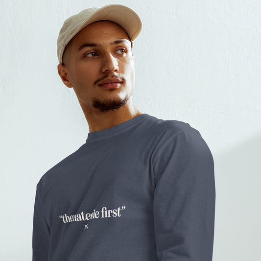 Man wearing 'they hated me first -JESUS' quote on a long sleeved navy tee