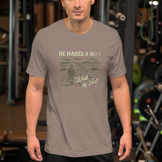 Man wearing “He Makes A Way – Walk By Faith” Christian t-shirt in gym; vintage cowboy design, minimalist style, soft cotton fit, faith-inspired activewear.