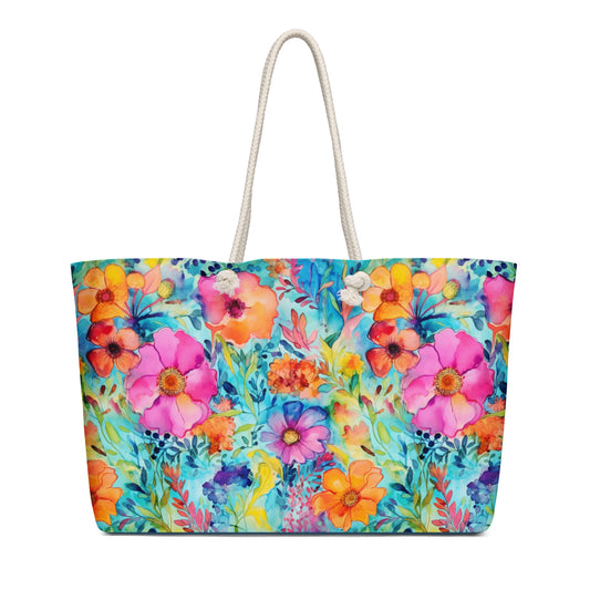 A large floral-pattern rope tote bag with cream-colored rope handles and spacious interior.