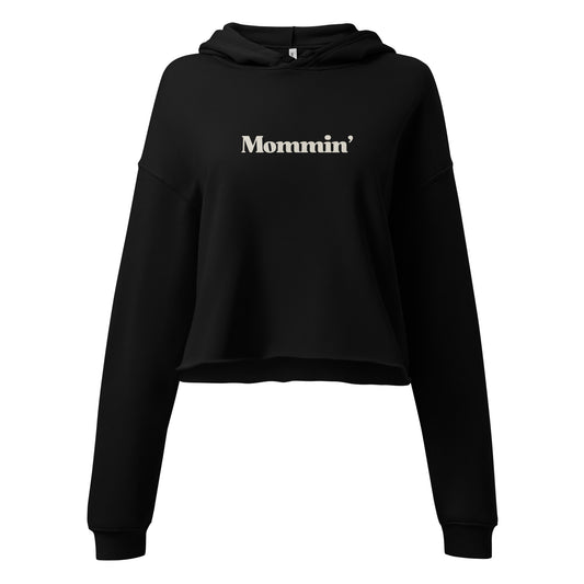 Mommin' text on a black cropped hoodie. Embrace the mommin movement.