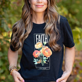 Faith over Fear floral tee on woman. Bold 'Faith' above flowers, small 'Fear' below on black shirt.