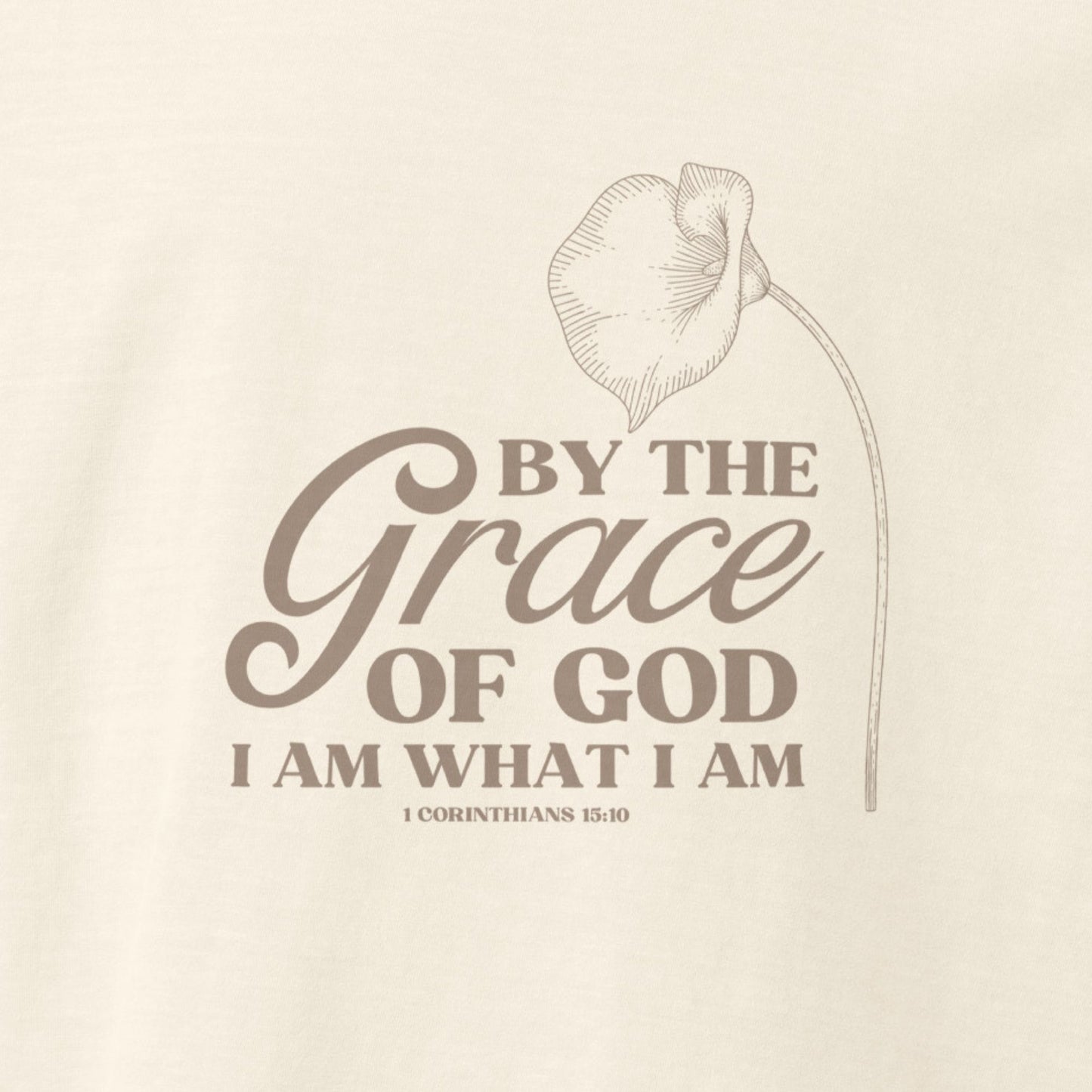 Up close of design on Vintage white colored Grace of God tee with lily and 1 Corinthians 15:10.  Faith message on Christian shirt.