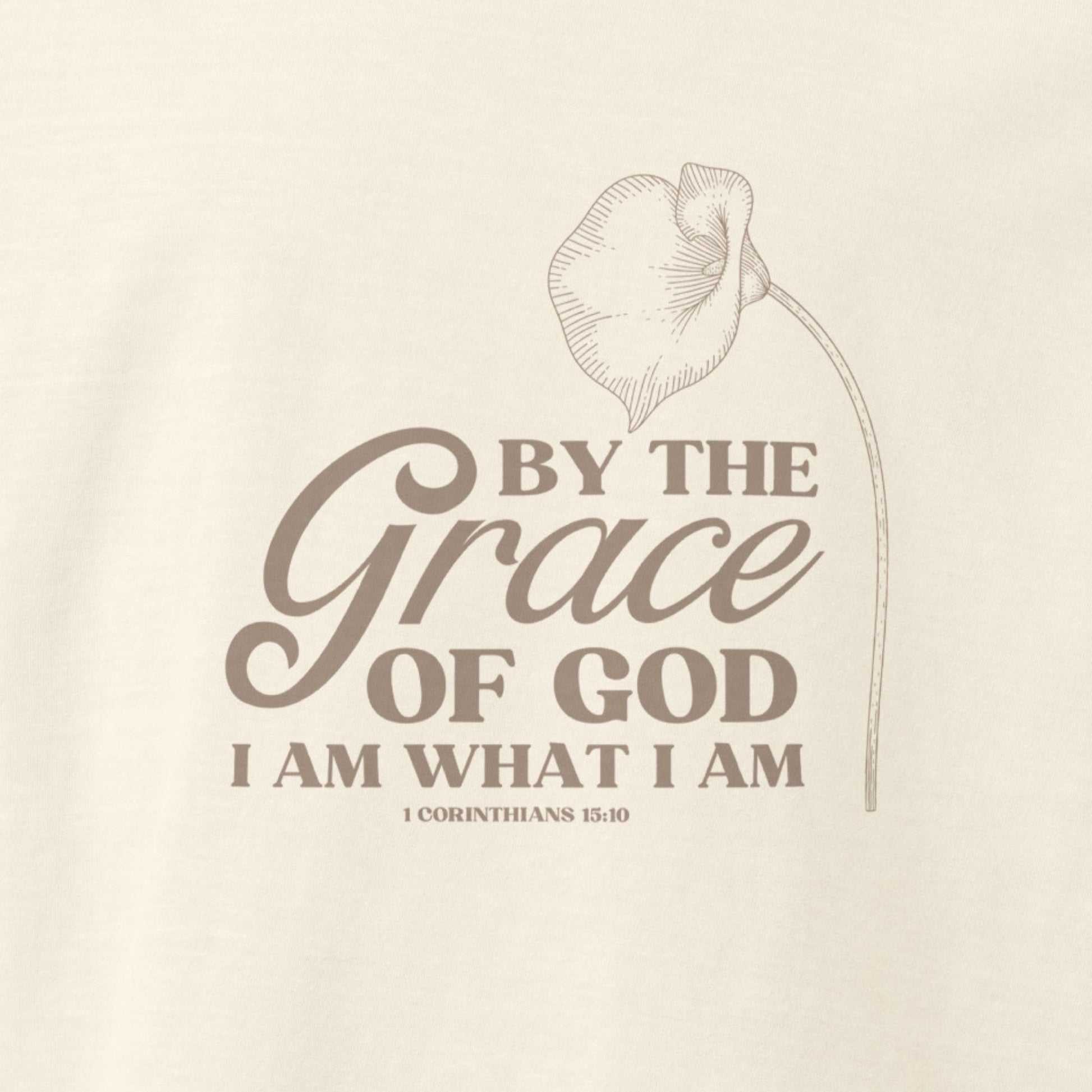 Up close of design on Vintage white colored Grace of God tee with lily and 1 Corinthians 15:10.  Faith message on Christian shirt.