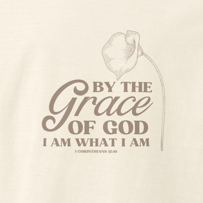 Up close of design on Vintage white colored Grace of God tee with lily and 1 Corinthians 15:10.  Faith message on Christian shirt.