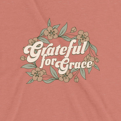 T-shirt with 'Grateful for Grace' text and floral design on a mauve background