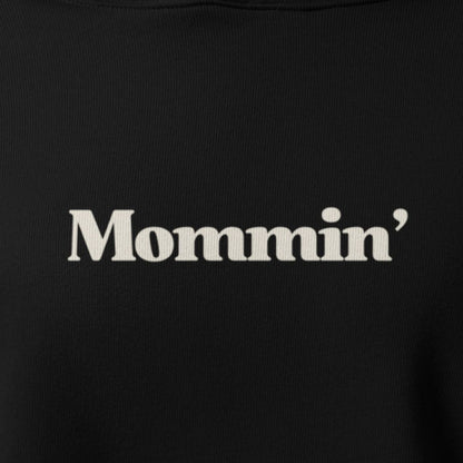 Black shirt with 'Mommin'' text in white on a plain background