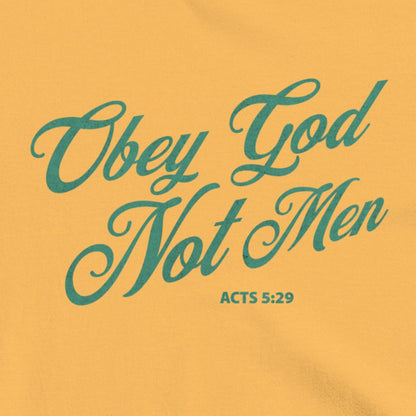 Obey God Not Men script font on a mustard colored t-shirt
