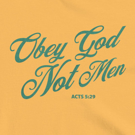 Obey God Not Men script font on a mustard colored t-shirt