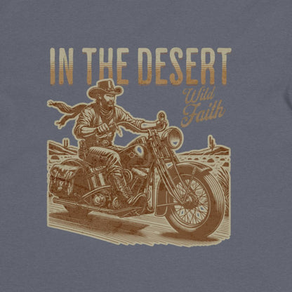 T-shirt design with a cowboy on a motorcycle and text 'In the Desert Wild Faith' on a blue background.
