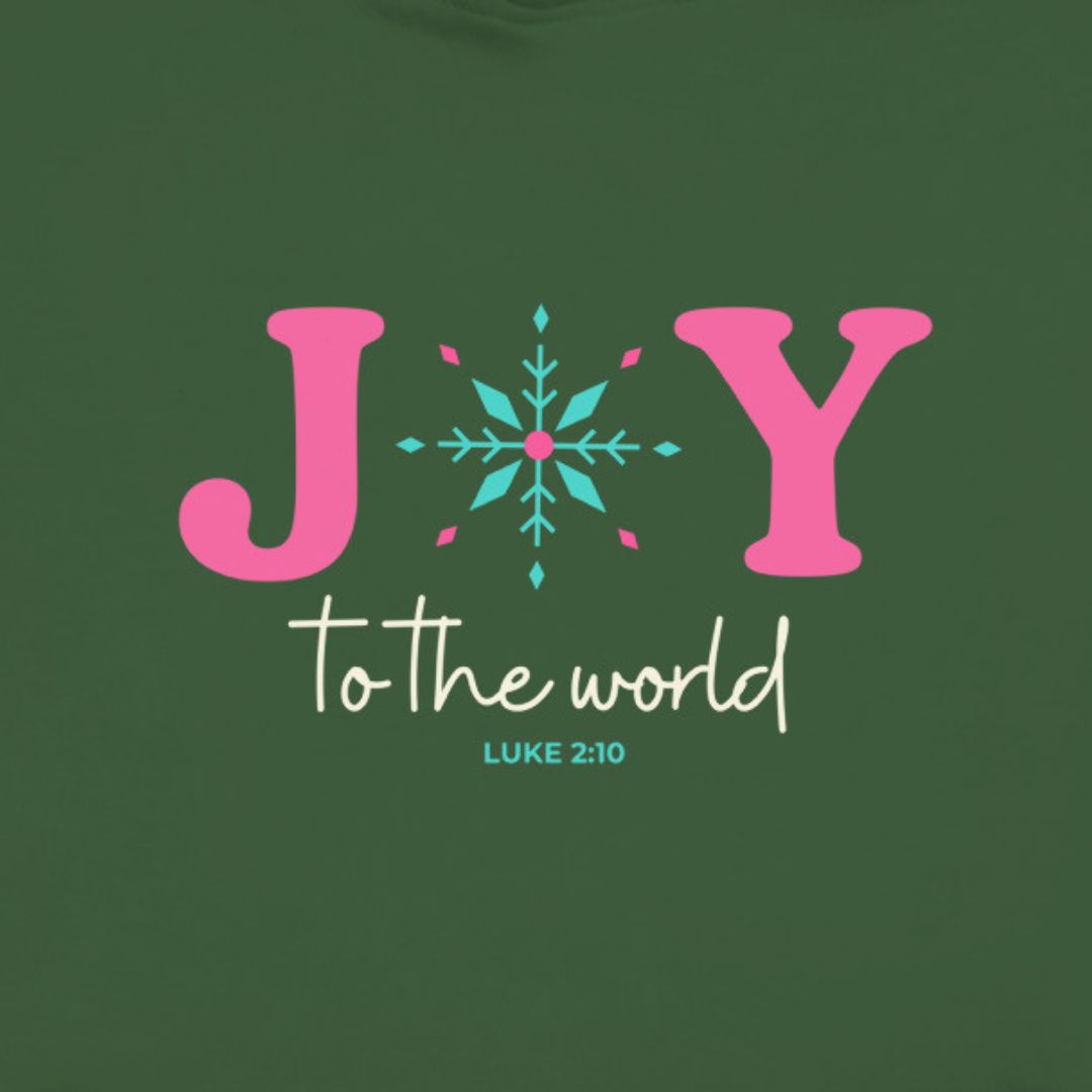 Joy to the world text, with Luke 2:10 referenced. The O in joy is represented by a snow flake. Christian apparel.