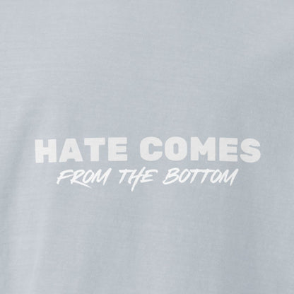 Light washed denim colored t-shirt with 'Hate Comes From The Bottom' text in white 