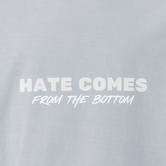 Light washed denim colored t-shirt with 'Hate Comes From The Bottom' text in white 