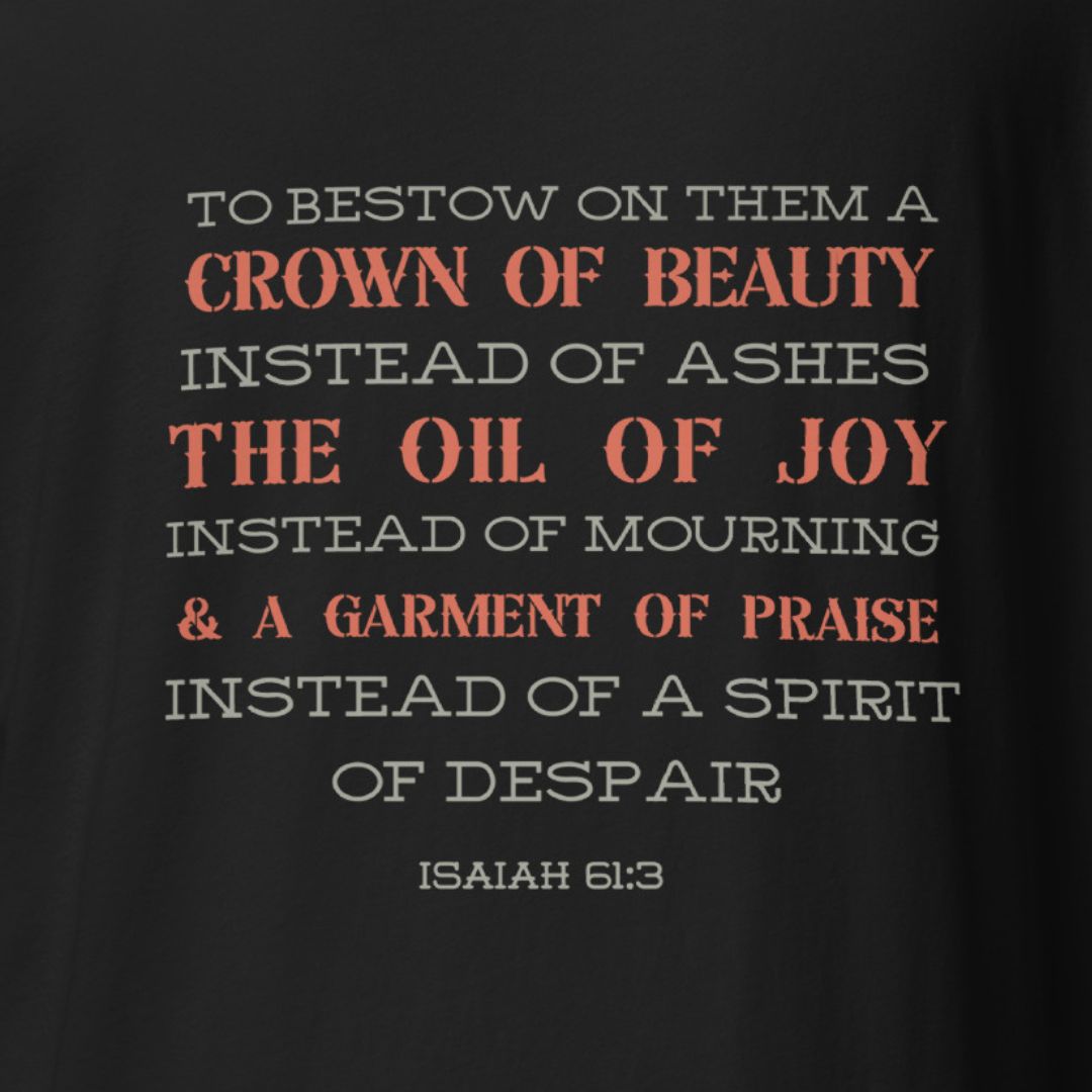 Black t-shirt with white and red text quoting Isaiah 61:3 on a black background