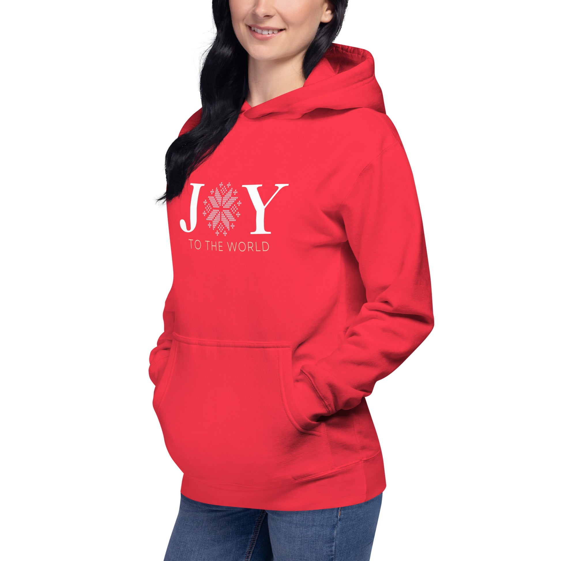 Female model wearing Team Red Joy to the World Hoodie, styled for cozy streetwear with a festive vibe and relaxed fit.