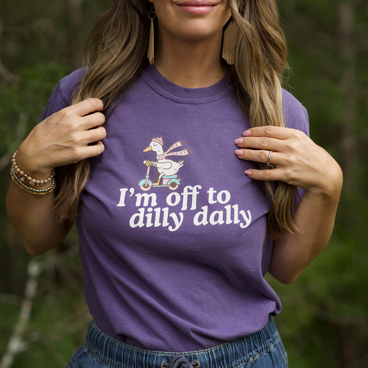 Dilly Dally Goose riding a scooter with the text saying I'm off to dilly dally. Funny shirt for all dilly dally-ers.