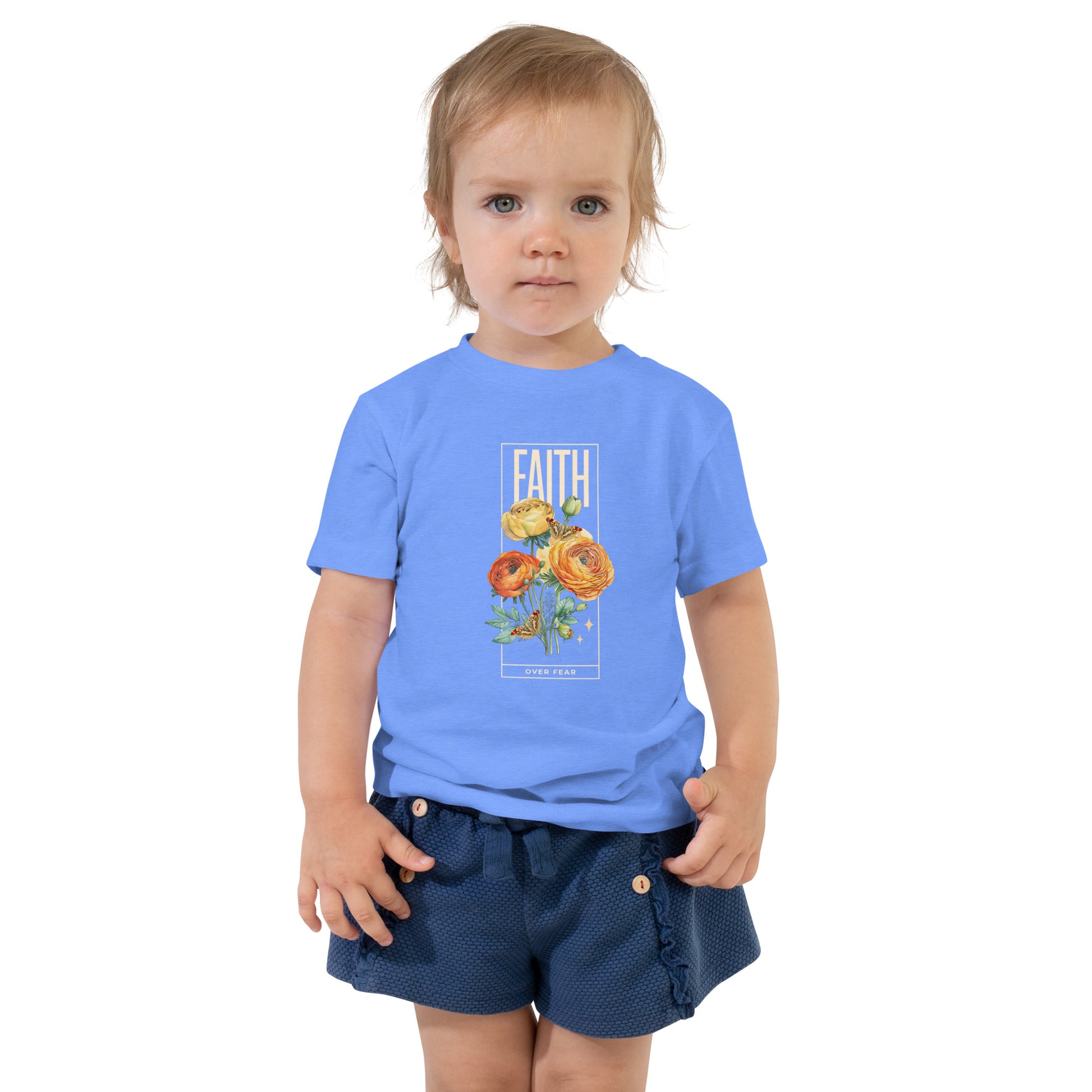 Toddler wearing light blue Faith Over Fear tee with colorful roses and butterflies.