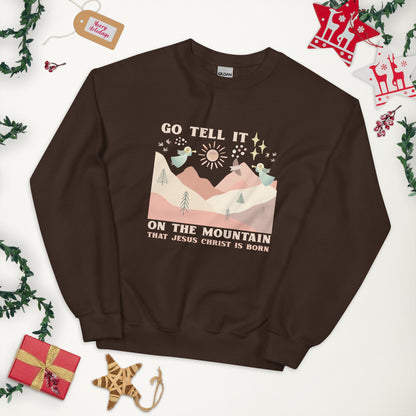 Dark chocolate colored sweatshirt with image of angels playing trumpets over the hills and mountains, with star of Bethlehem and doves in the background. Go tell it on the mountain that Jesus is born.