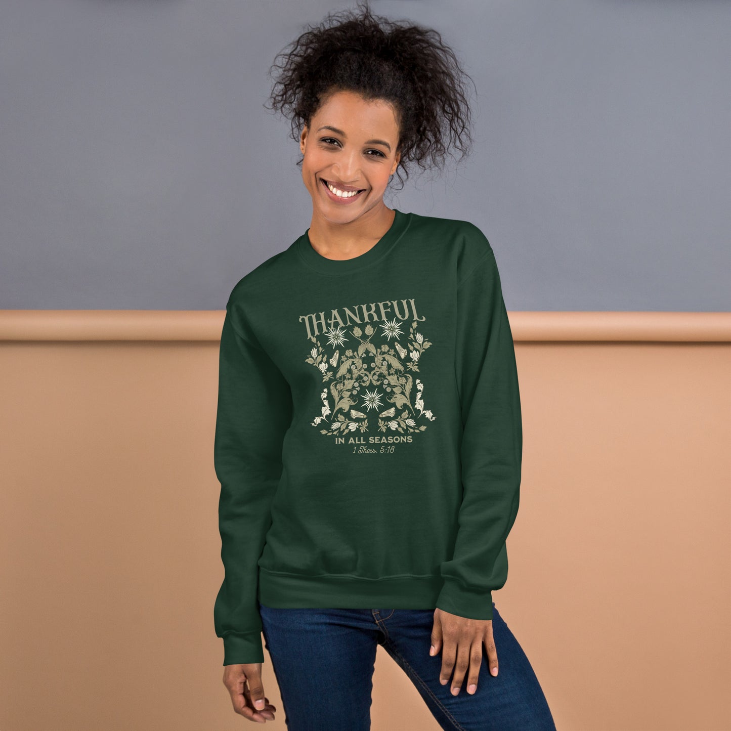 Smiling female model wearing Forest Green Thankful Sweatshirt, styled for cozy faith-filled fashion and everyday comfort.