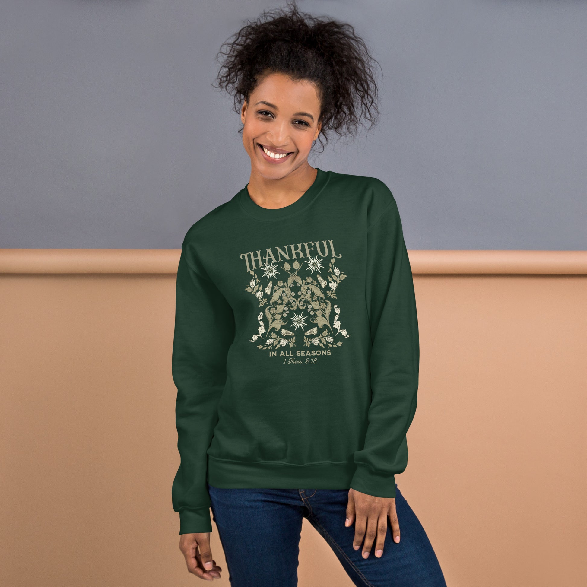 Smiling female model wearing Forest Green Thankful Sweatshirt, styled for cozy faith-filled fashion and everyday comfort.