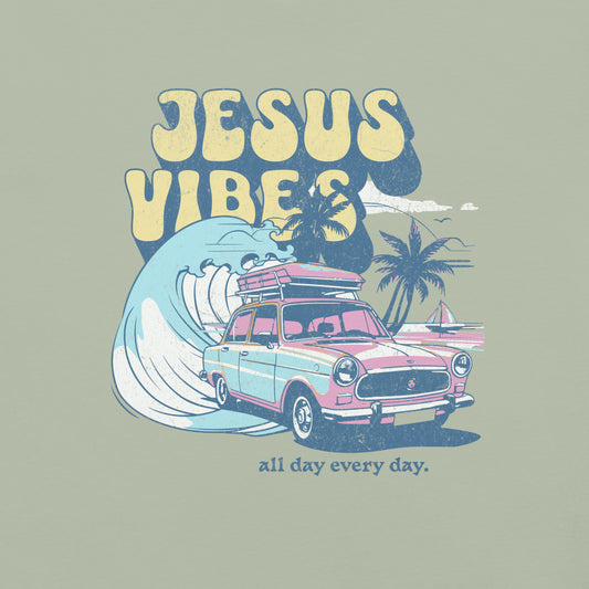 Retro-style ‘Jesus Vibes’ graphic on bay green Comfort Colors t-shirt featuring pastel vintage car, wave, palm trees, and the phrase ‘all day every day.