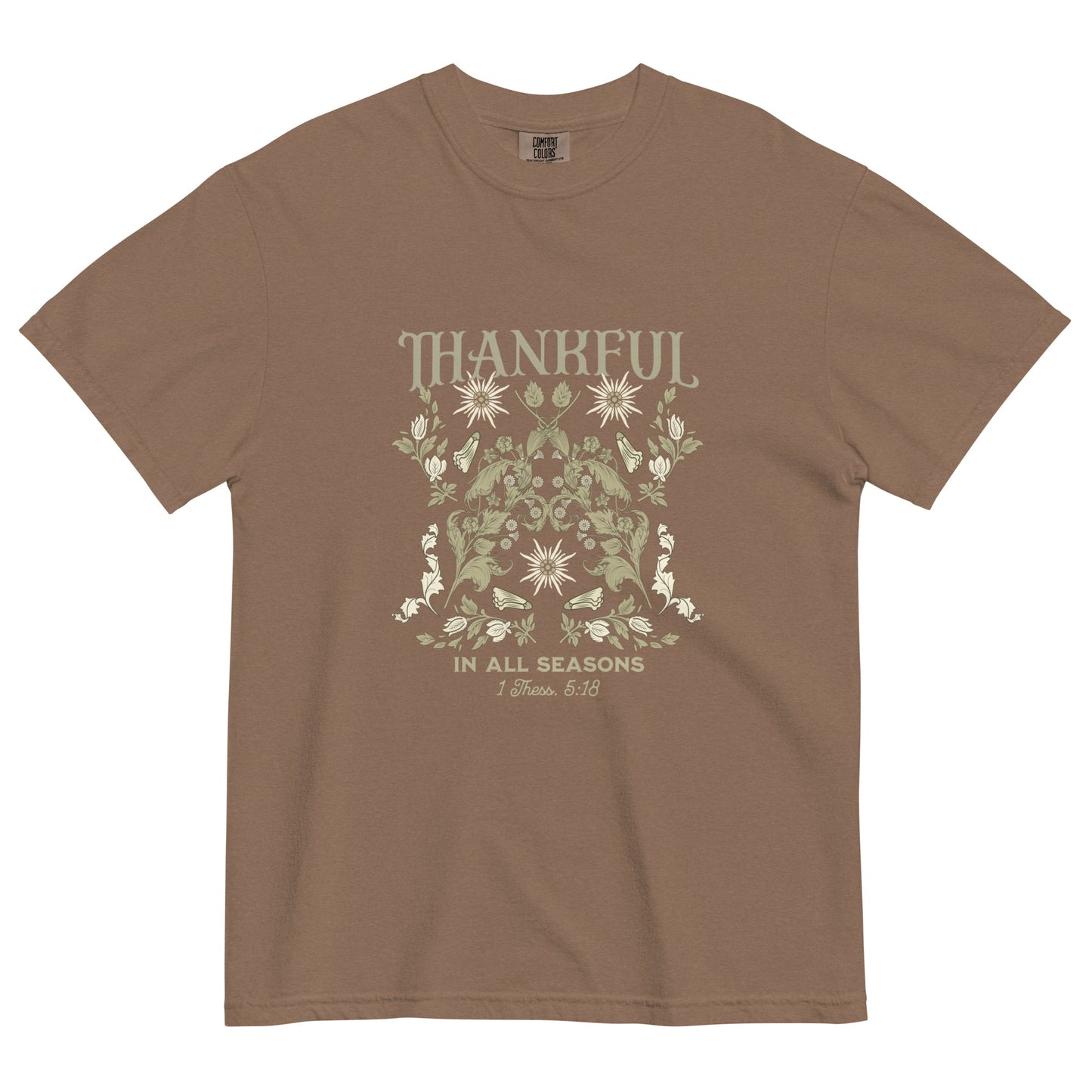 Thankful in All Seasons tee with 1 Thessalonians 5:18 verse. Faith-inspired design on seasonal-themed shirt.