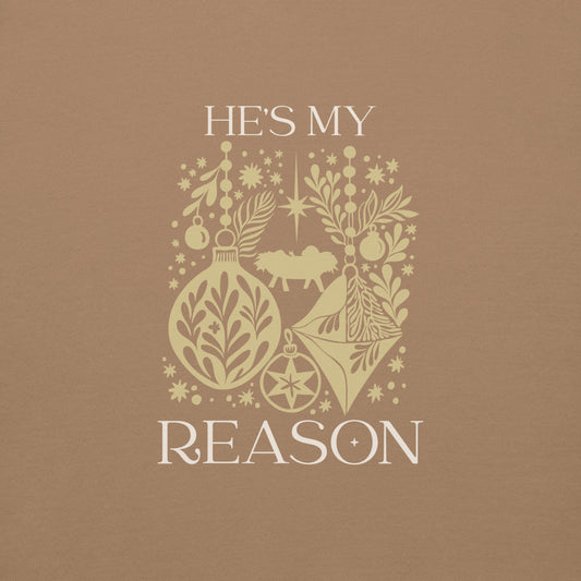 Gold "He is my reason" text with silhouette collage of ornaments, baby Jesus, stars, snowflakes on a latte colored sweatshirt