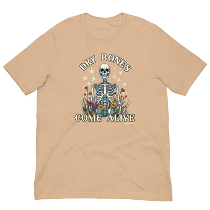 Western-style tan t-shirt featuring Dry Bones skeleton, star accents, colorful flowers, and Ezekiel 37:4 text. Graphic tee.