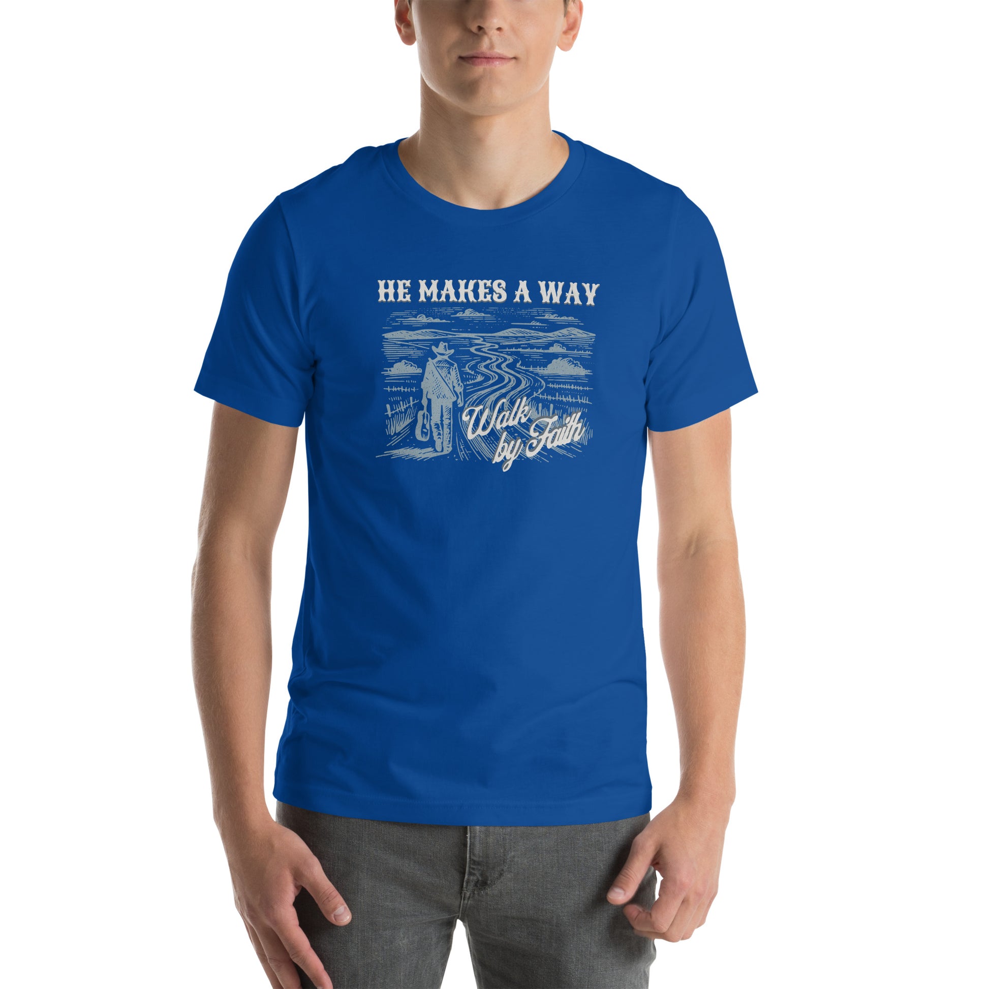 Man wearing Royal Blue T-shirt with a graphic of a person walking on a path with text 'He Makes A Way, Walk by Faith' 