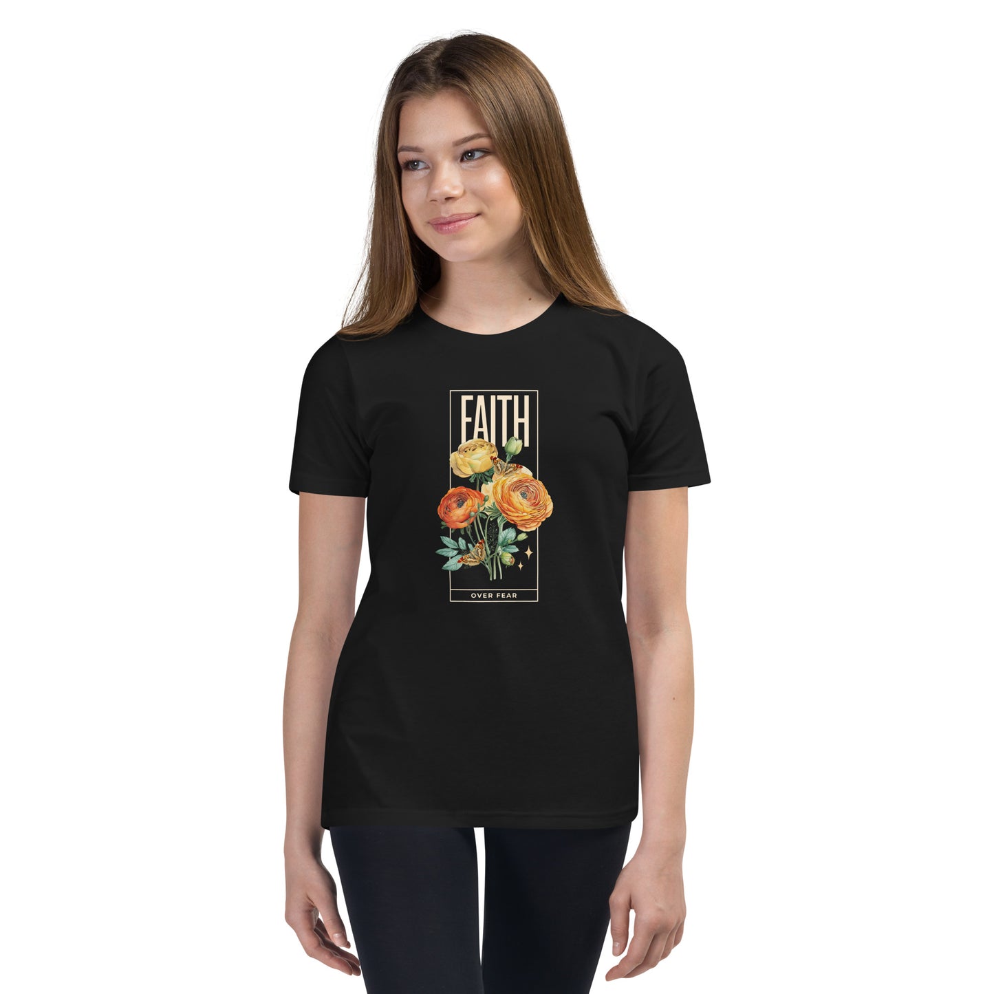 Girl wearing black Faith Over Fear t-shirt with colorful roses and butterflies.