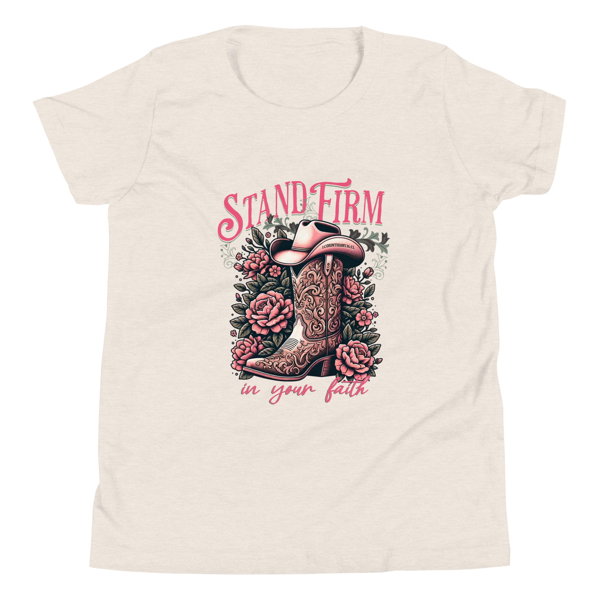 Decorative graphic with cowboy boot, flowers, and 'Stand Firm in Your Faith' text on a heather dust colored shirt. 1 Corinthians 16:13 inscribed on bill of hat.